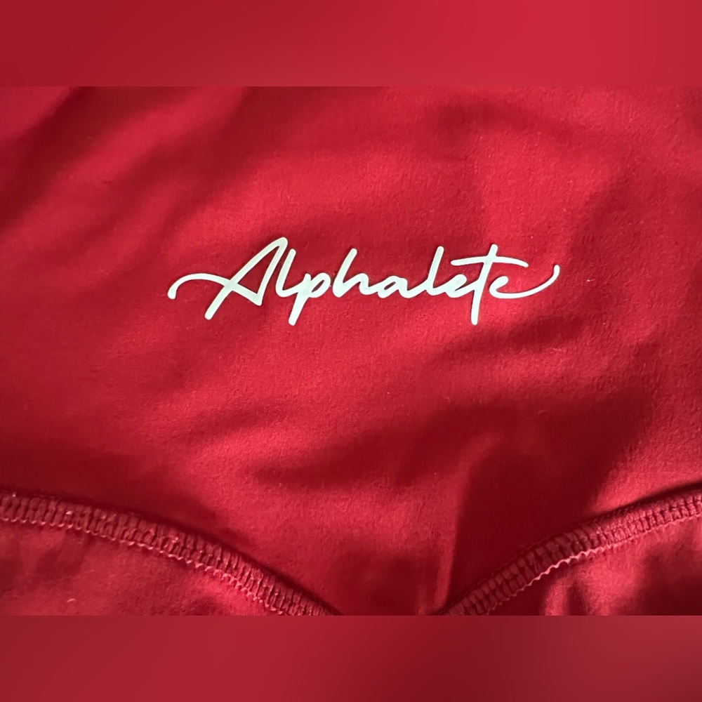 Alphalete pulse kinetic legging in red.